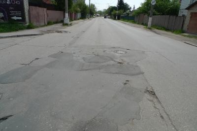 В Рязани на дорожных ямах нарисовали карикатуры на мэра города, чтобы привлечь его внимание к проблеме дорог (ФОТО)